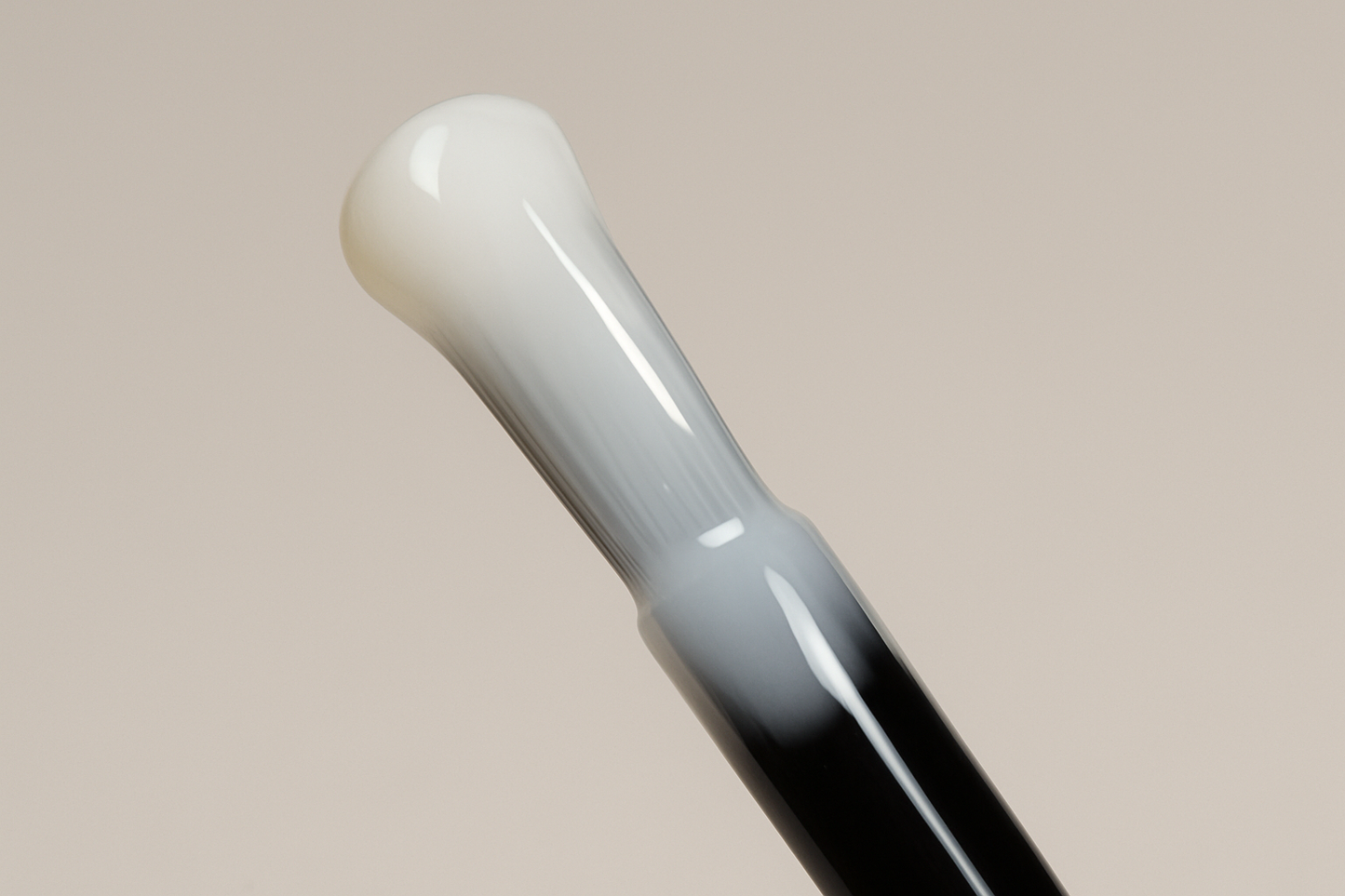 nail milky top coat on the brush