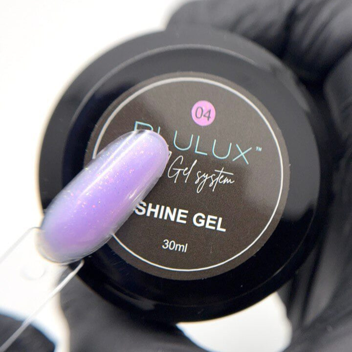 Shine Gel container with a gloved hand holding a brush with purple nail polish.