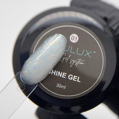 Fulux Shine Gel container with a gray nail tip on a white background